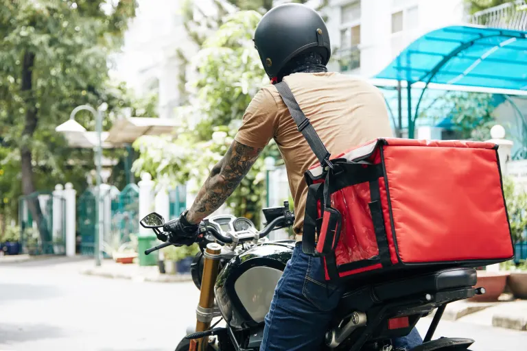 takeaway delivery driver on motorbike