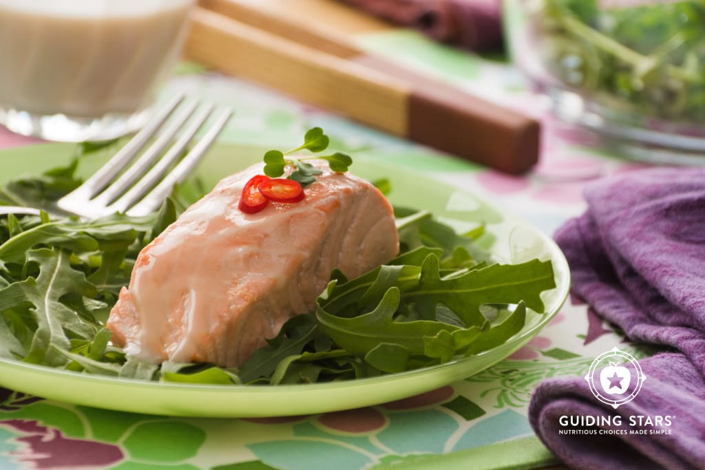 Poached Coconut Salmon Over Greens
