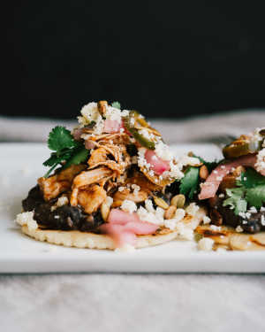 Chicken Tinga Tostadas w/ Green Chile Black Beans