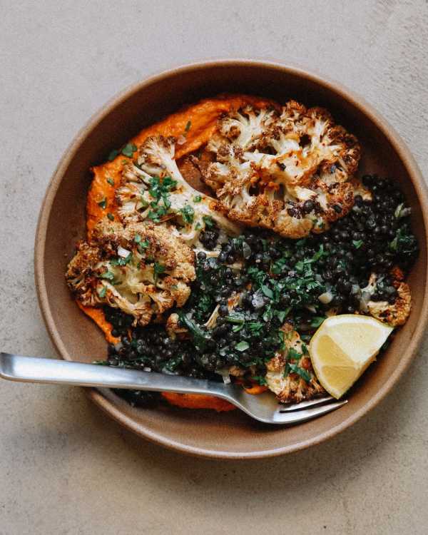 Garlic-Roasted Cauliflower Steaks w/ Mustardy Lentils & Cashew Romesco