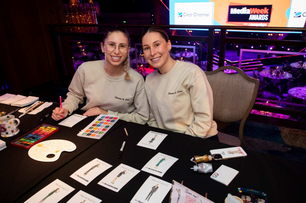 Siena and Ellie live sketching at an event