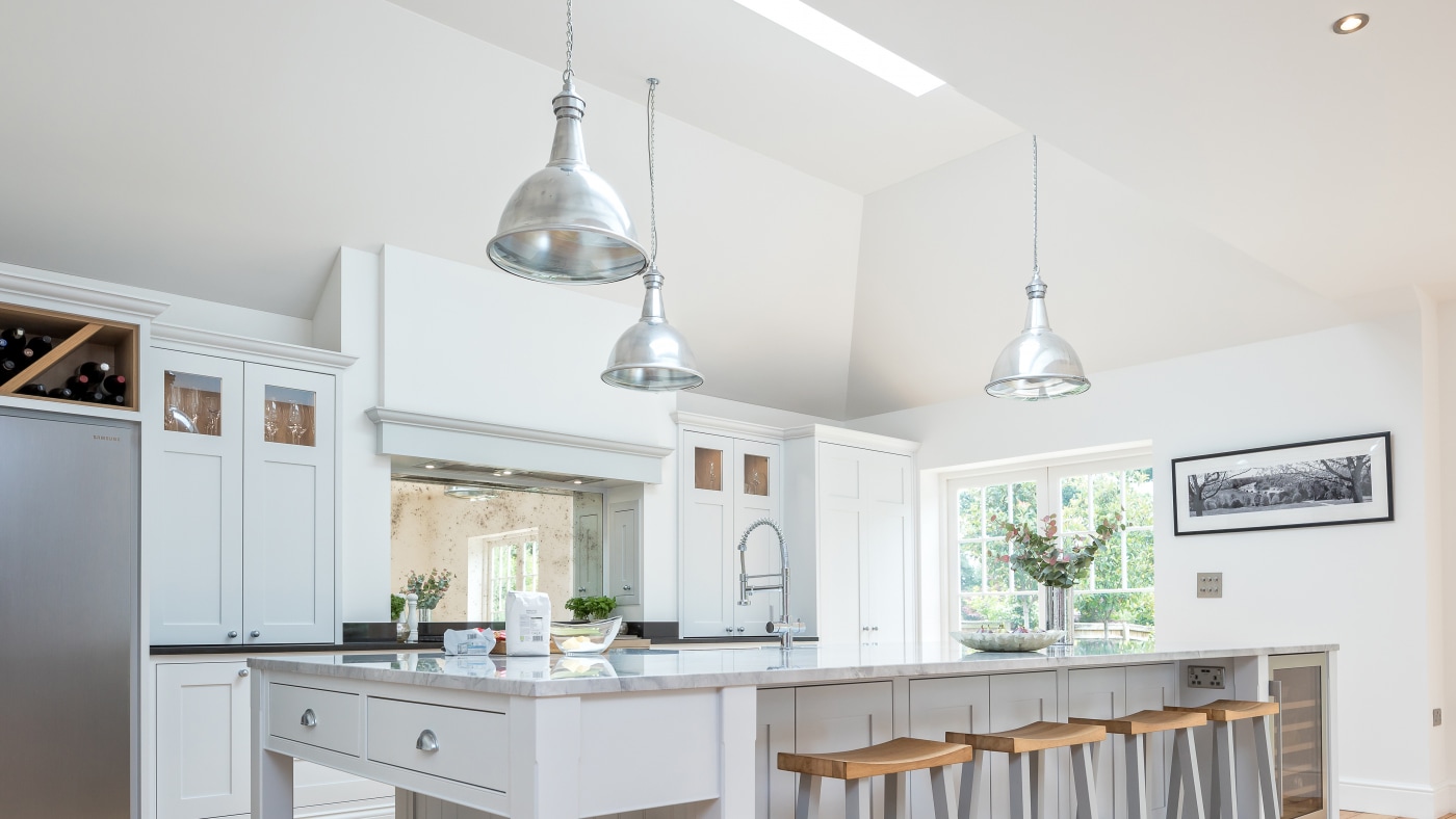 Family kitchen renovation featuring industrial skinflint lighting