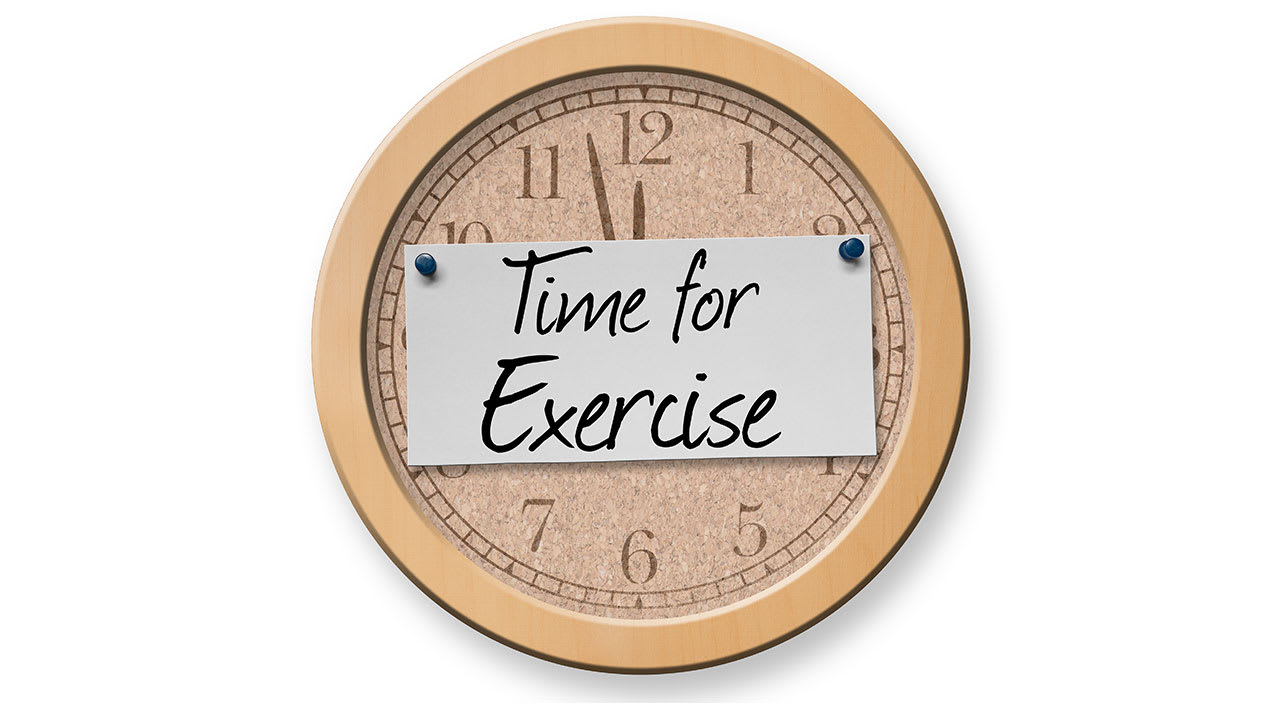 Clock with time for exercise written on it.
