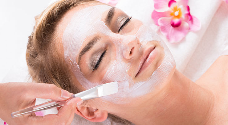 Woman getting chemical peel treatment.