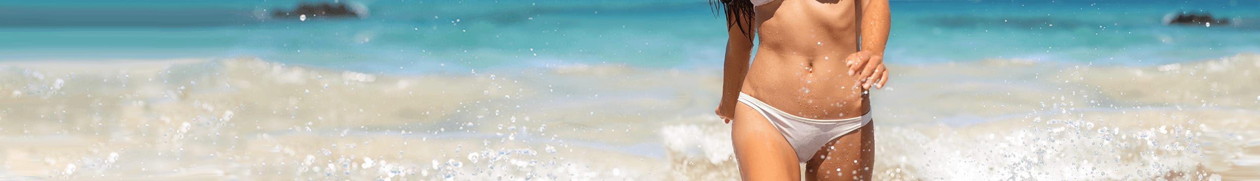 woman in bikini walking on beach