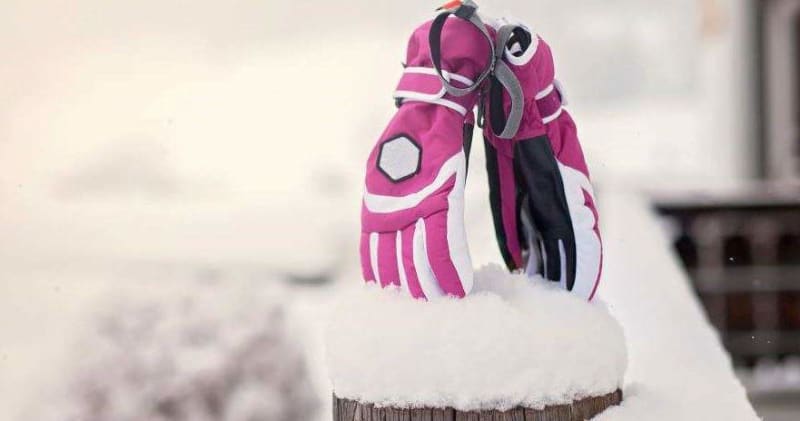 two gloves stuck in the snow