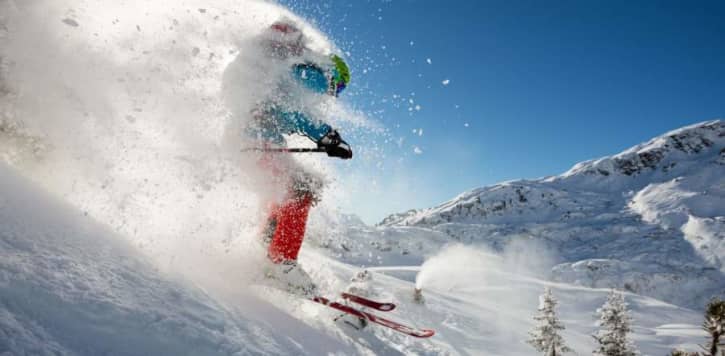 Man skiing surrounded by cold snow