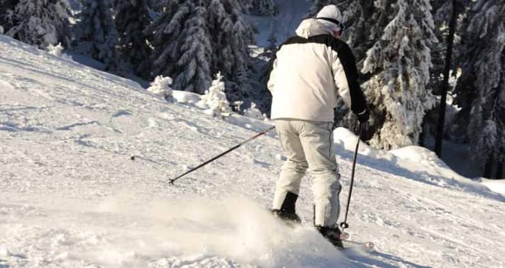 Beginner skiing doing a stop