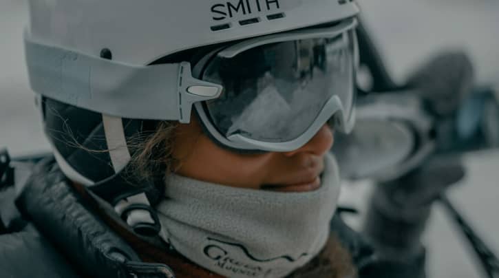 Skier wearing a face covering to keep warm for winter snow sports