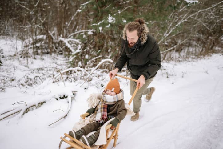 Father and son playing in the snow