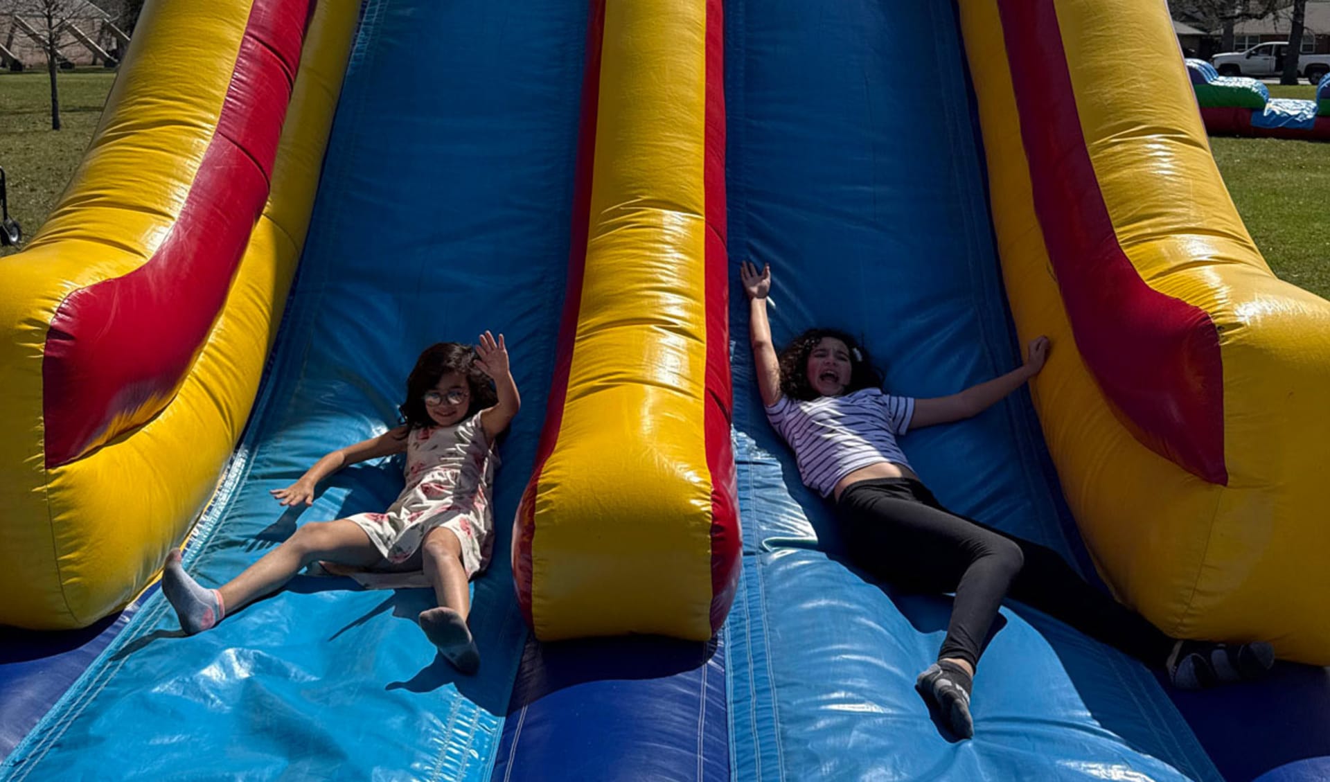 Kids Sliding down 60ft Obstacle Course Rentals