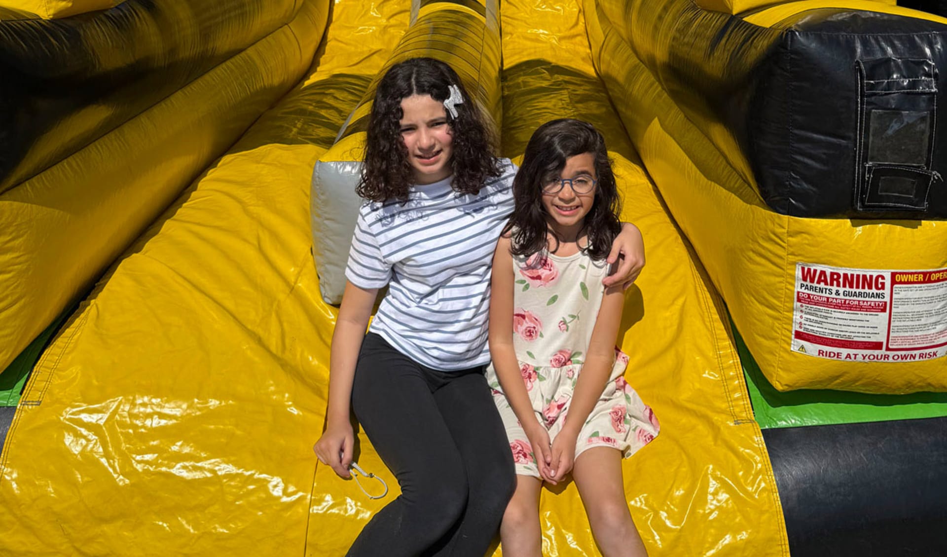 Sky High Kids in front of Adrenaline toxic Obstacle Course Bounce house