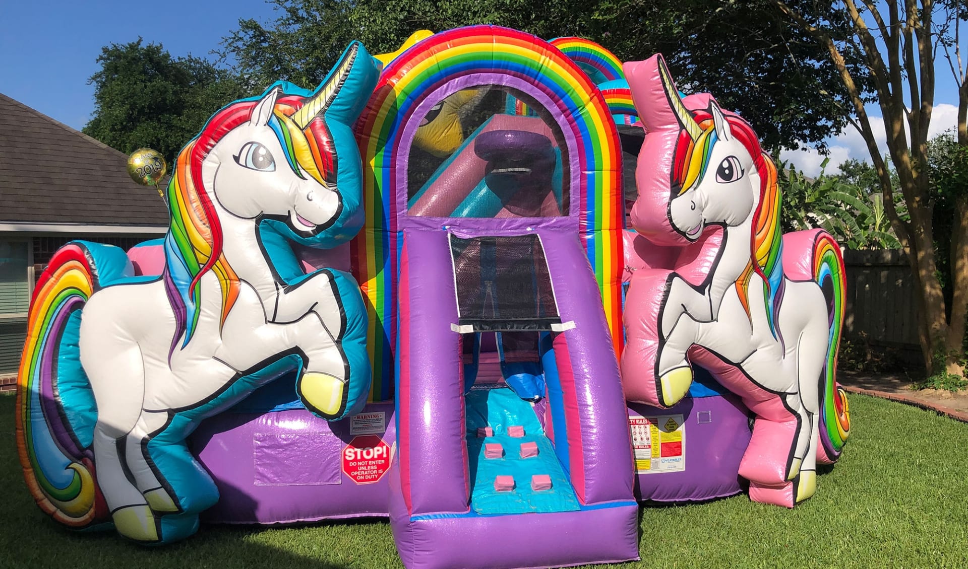 Unicorn bounce house rental entrance
