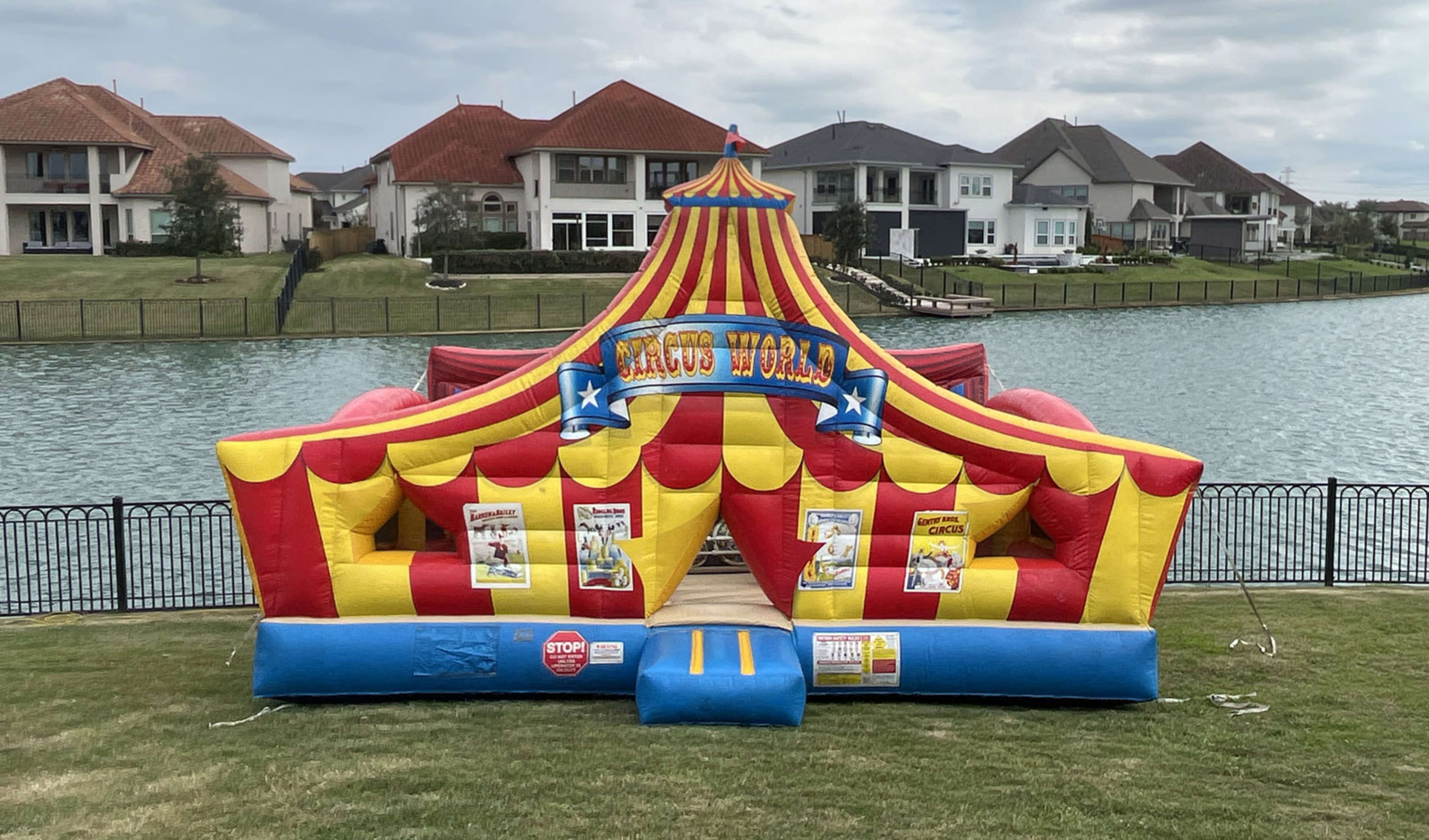Circus Toddler bounce house in front of Lake