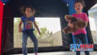 Kids in Houston playing at a complete Star Wars-themed party rental setup, including an inflatable moonwalk with character art, the Death Star, and a giant Millennium Falcon topper. Children are seen using the slide and eating snacks like popcorn. Adults  Youtube