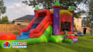 A classic carnival-themed carousel bounce house featuring red and yellow stripes with detailed horse and giraffe graphics on the mesh walls. This interactive inflatable attraction is set up for an outdoor event and is available for rent in Houston, Austin Youtube