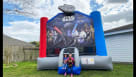 Kids in Houston playing at a complete Star Wars-themed party rental setup, including an inflatable moonwalk with character art, the Death Star, and a giant Millennium Falcon topper. Children are seen using the slide and eating snacks like popcorn. Adults  Youtube