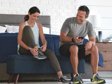 Family standing infront of Sleep Number truck