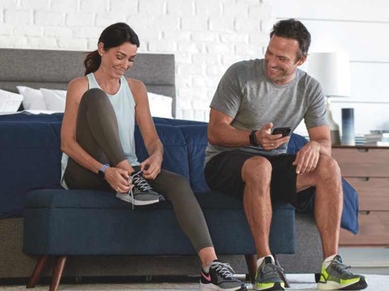 Person testing out a Sleep Number smart bed in-store