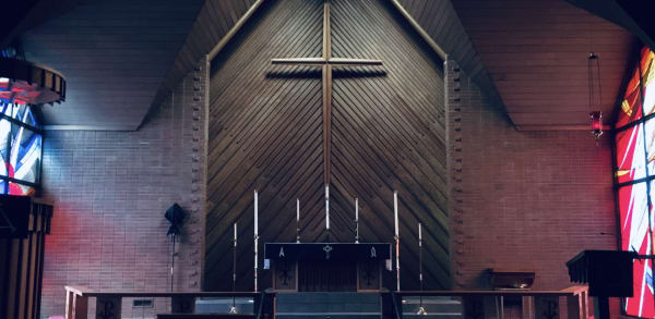 old wooden church front with a wooden cross
