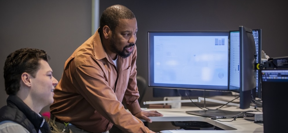 Two women talking in the office.