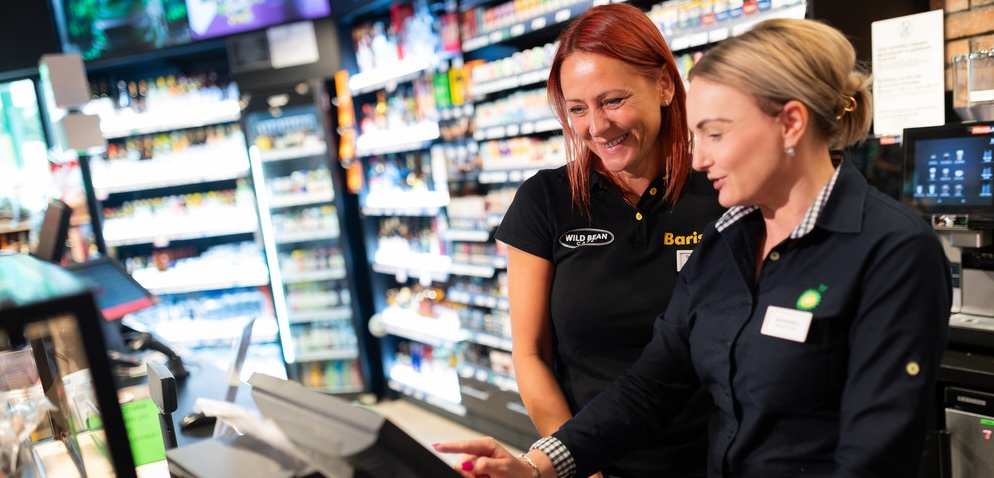 Two women talking in the office.