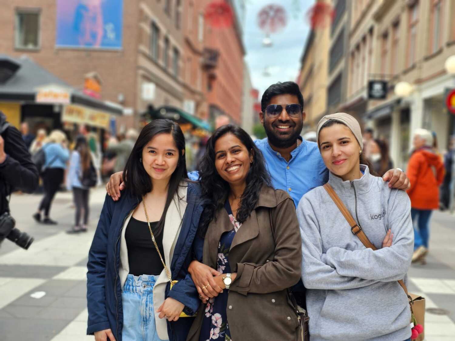 Four employees in city street