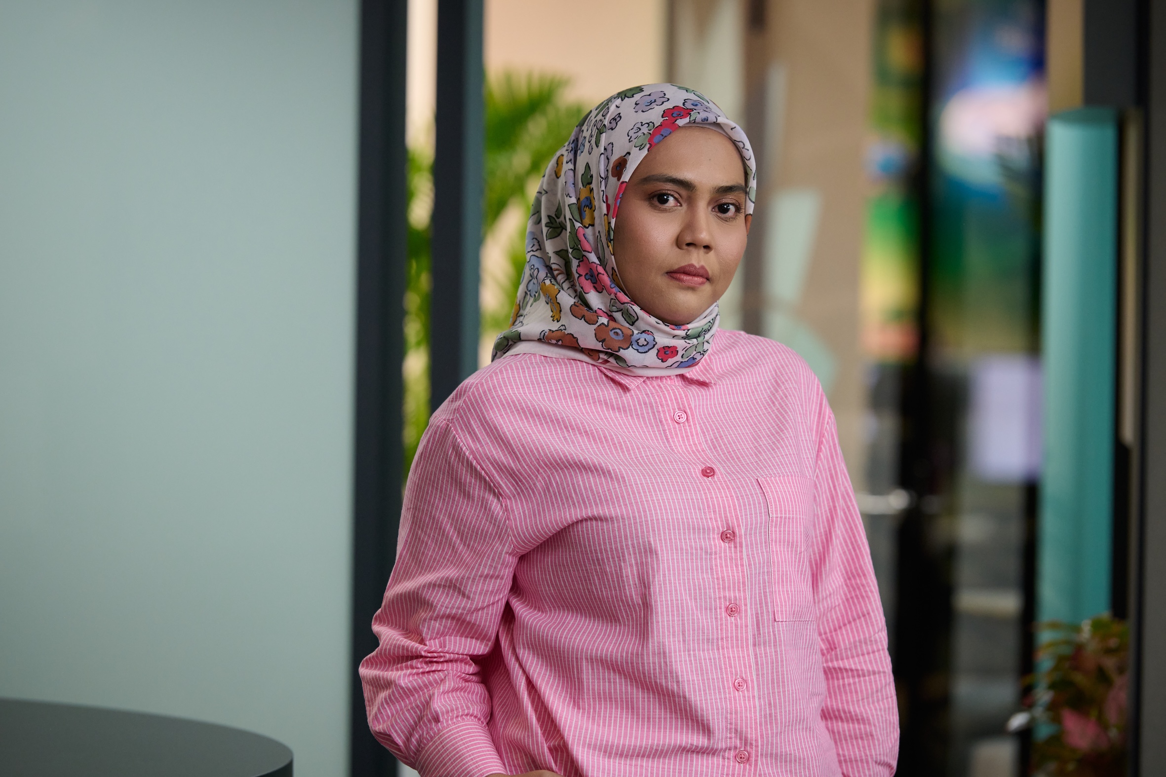 female bp employee in green.