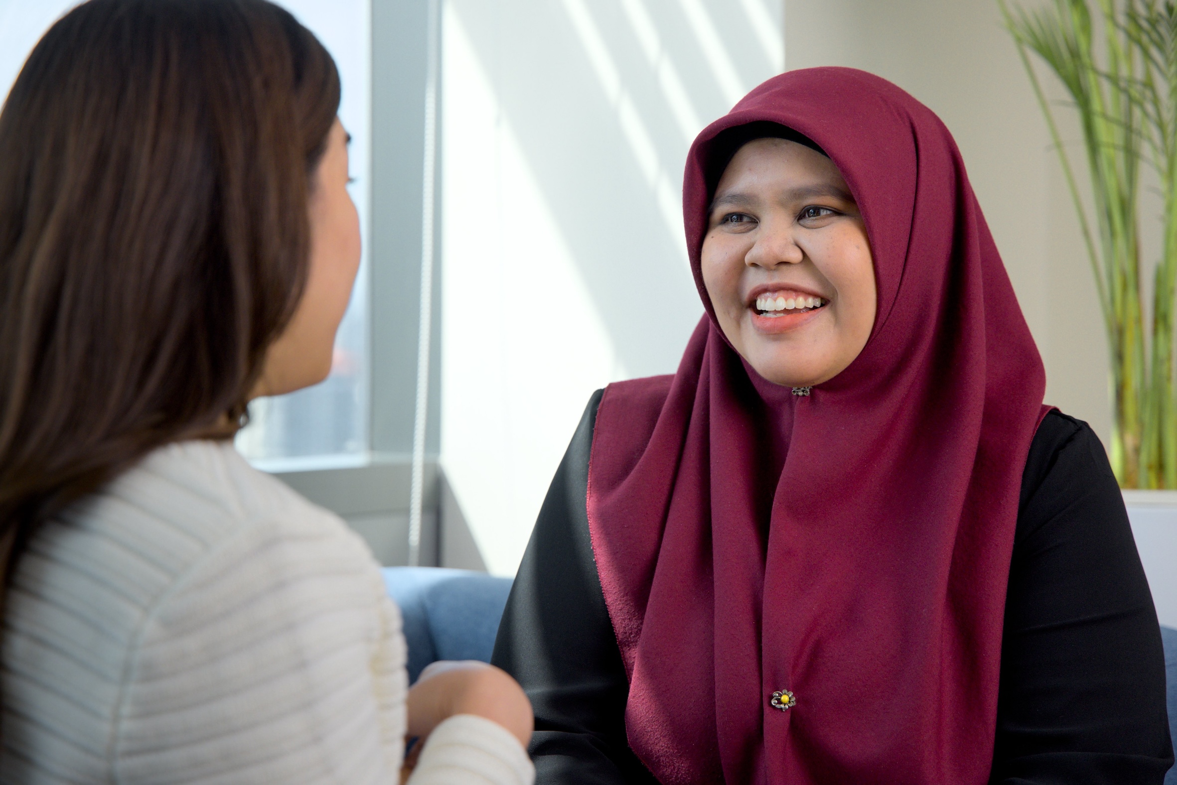 BP employees enjoying coffee break, smiling and connecting.