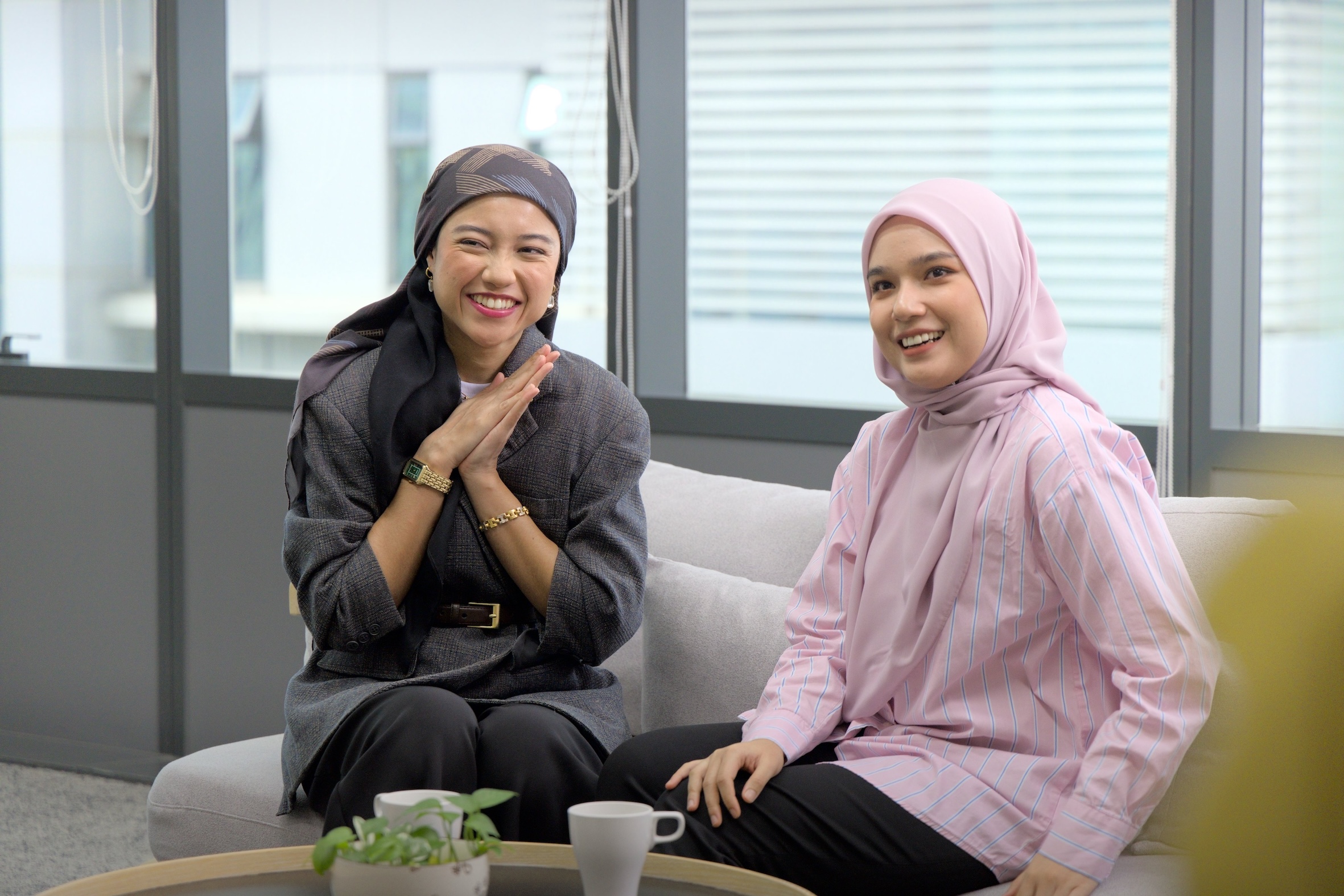 bp co-workers smiling in the office.