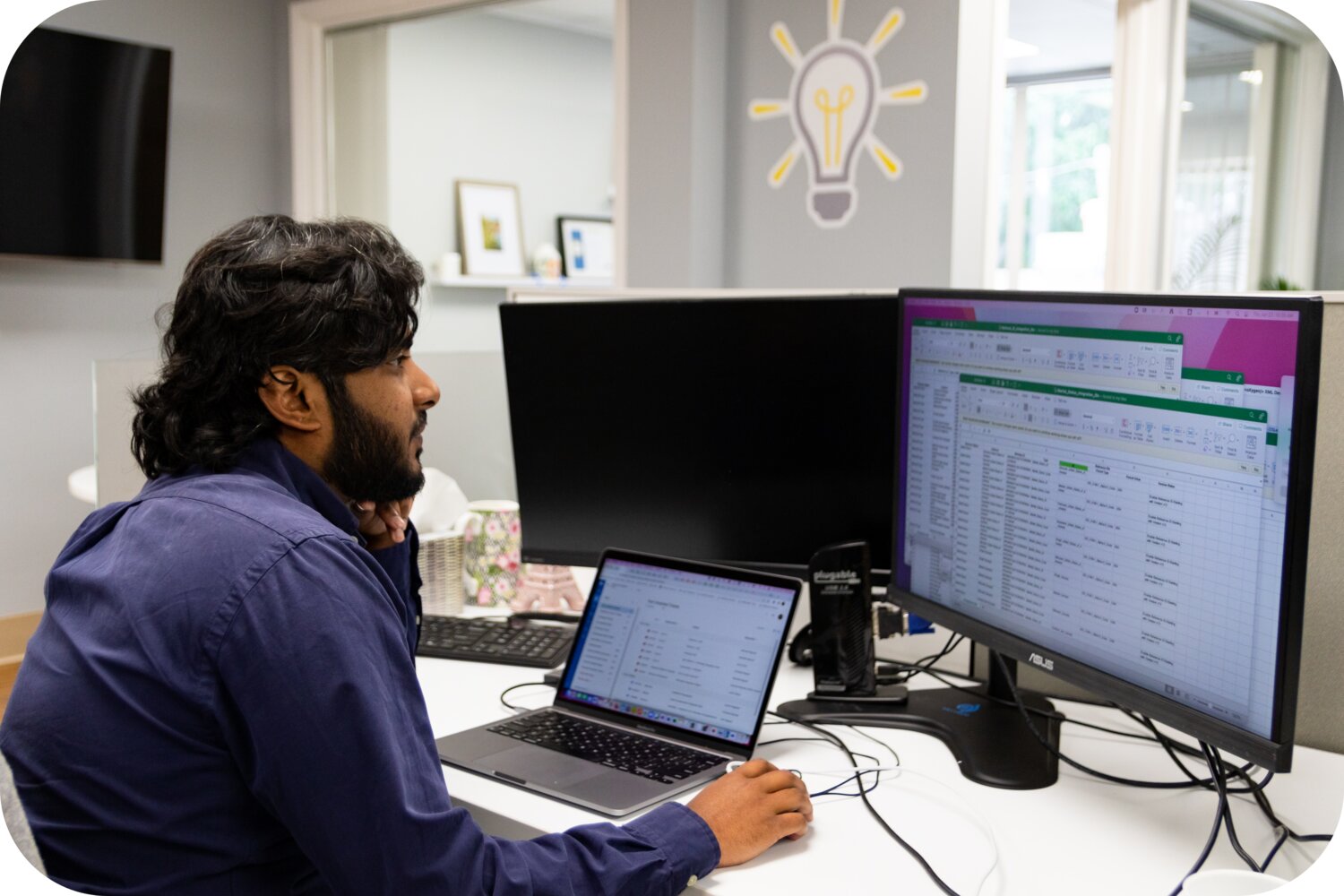 employee working on multiple screens
