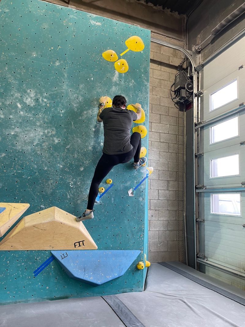 man climbing a wall
