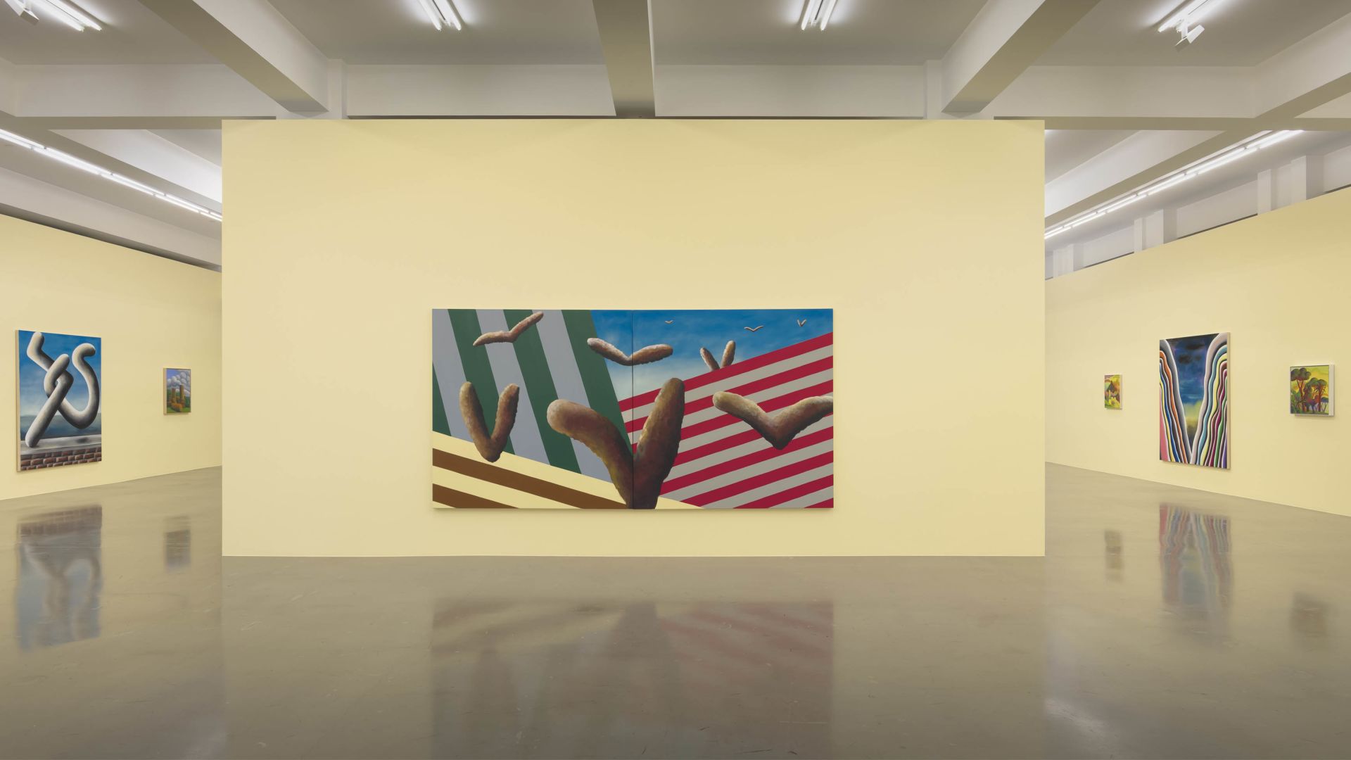 Gallery view showing a large central painting with cacti against stripes, flanked by smaller landscape artworks