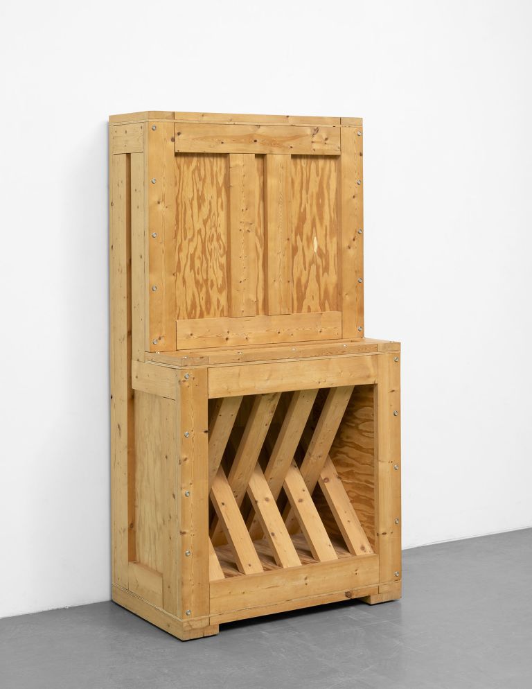 RA-19 (1995), a sturdy-looking box that appears to conceal a package object waiting to be installed, its outline suggesting one of Artschwager's piano sculptures, is empty