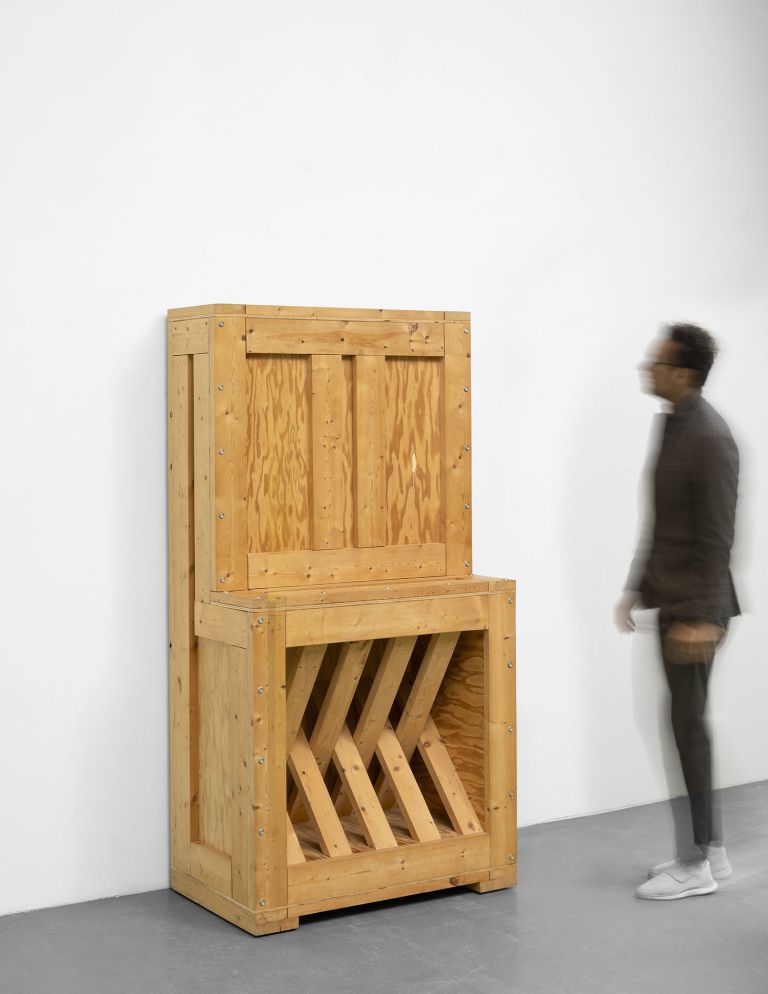RA-19 (1995), a sturdy-looking box that appears to conceal a package object waiting to be installed, its outline suggesting one of Artschwager's piano sculptures, is empty