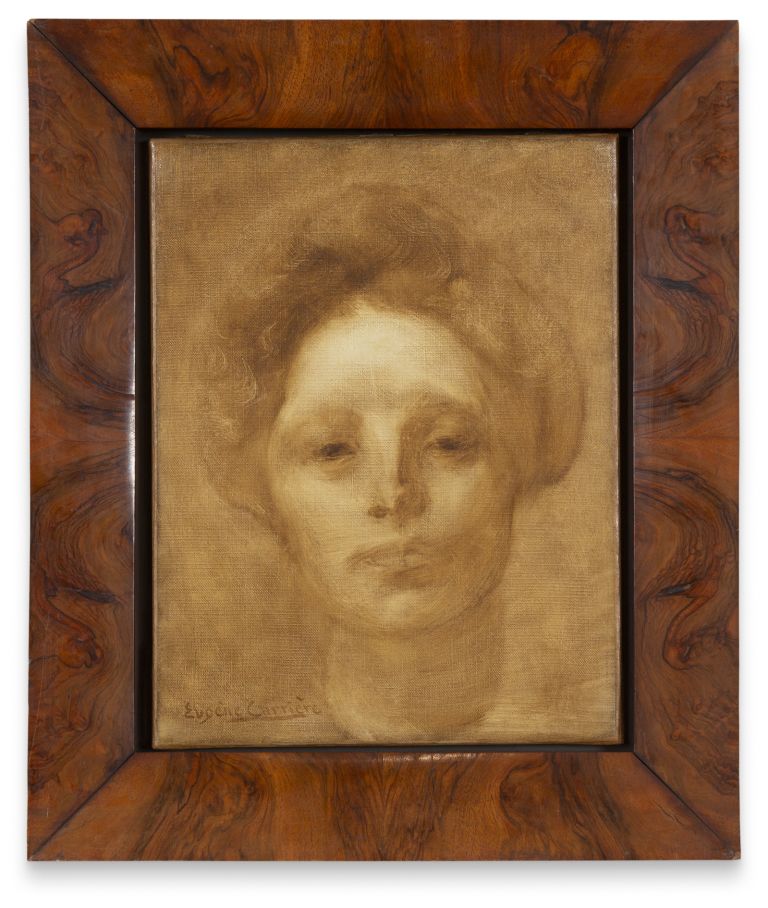 Portrait painting in ornate wooden frame showing a person with curly hair rendered in warm, sepia tones on canvas.