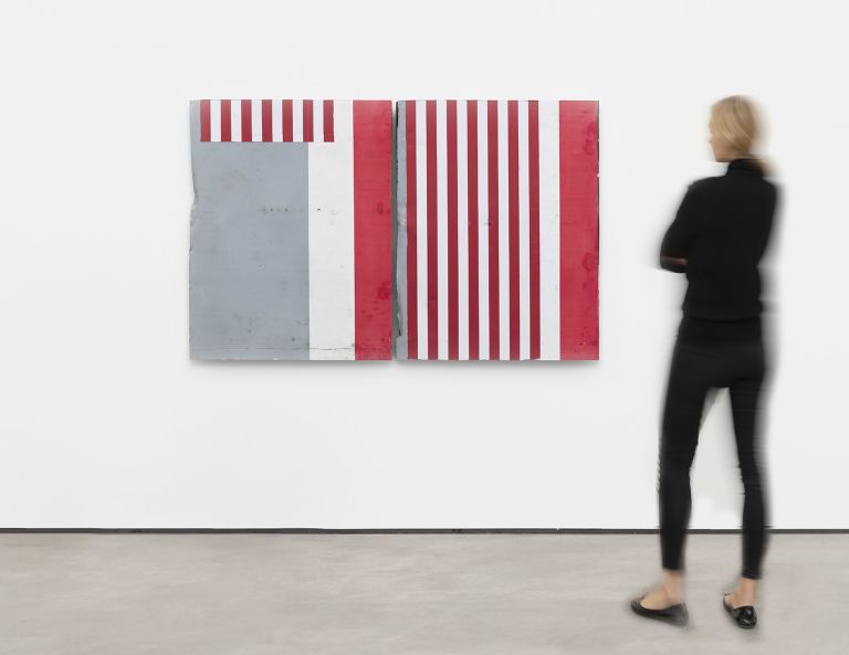 Abstract artwork consisting of two panels with red and white stripes and solid color blocks in red, white, and gray