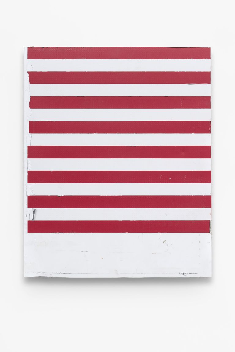 Minimalist artwork with white perforated metal lower section and red and white horizontal stripes in the upper section