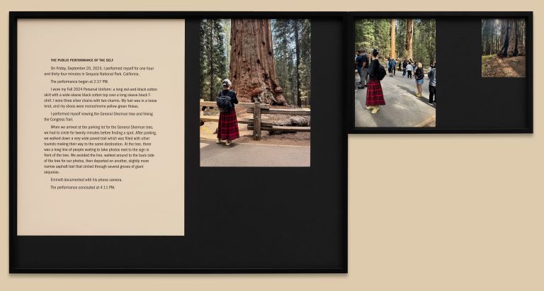 Exhibition panel with descriptive text and photographs showing performance documentation in outdoor forest settings with large trees.