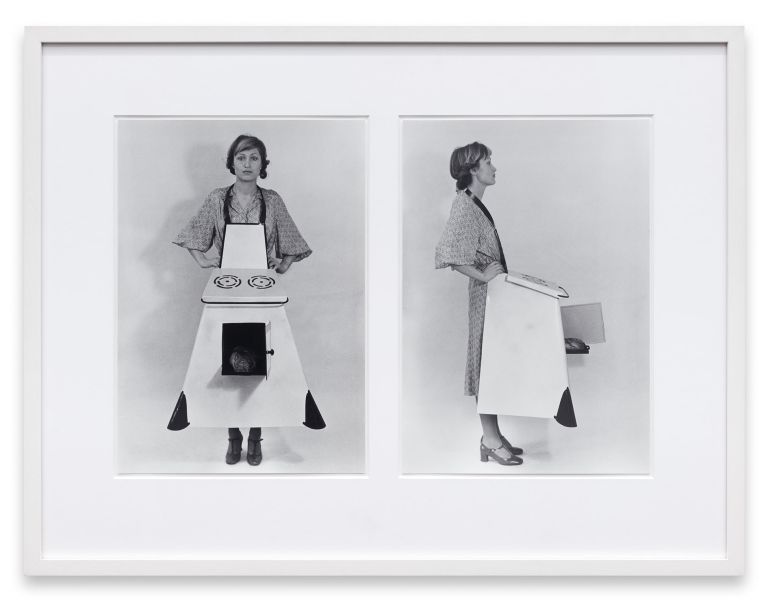 Two black and white photos of a woman wearing a stove costume with burners on top, shown from front and side views