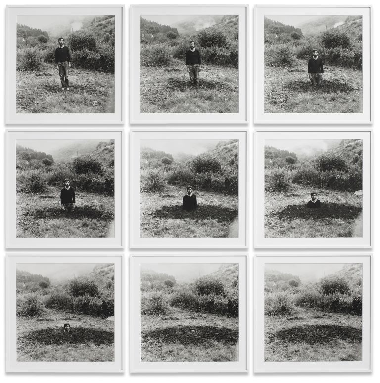 Grid of nine identical black and white photographs showing a person gradually disappearing into a landscape.