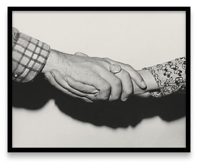 Five framed black and white photographs in a row showing different handshake positions between two people wearing different sleeves