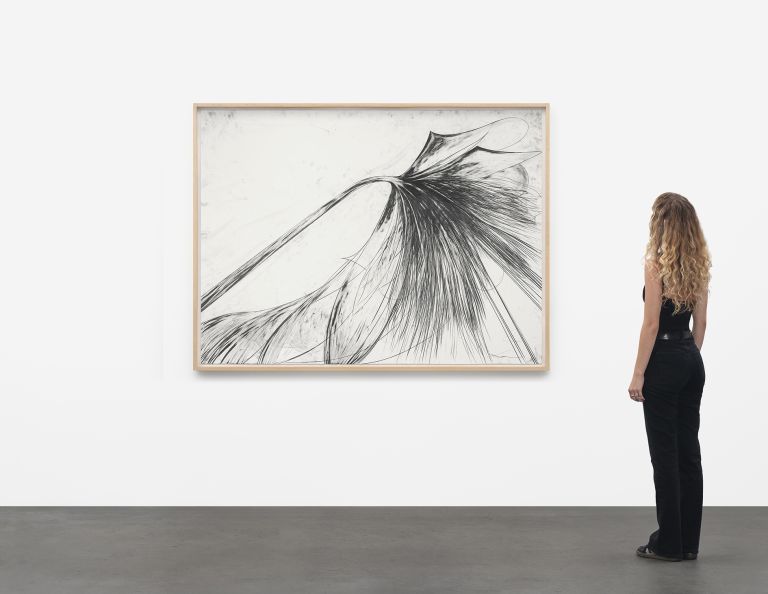 Framed abstract drawing with explosive black lines radiating outward on white background