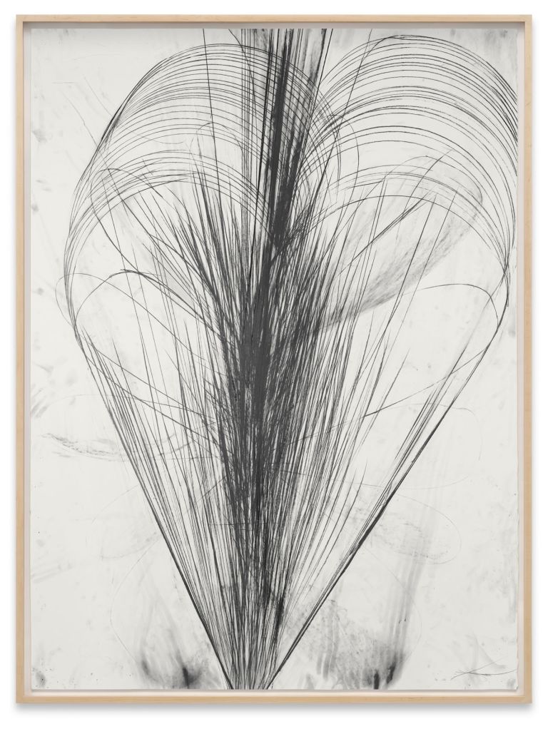 Framed abstract drawing showing heart-shaped black graphite burst with flowing radiating lines