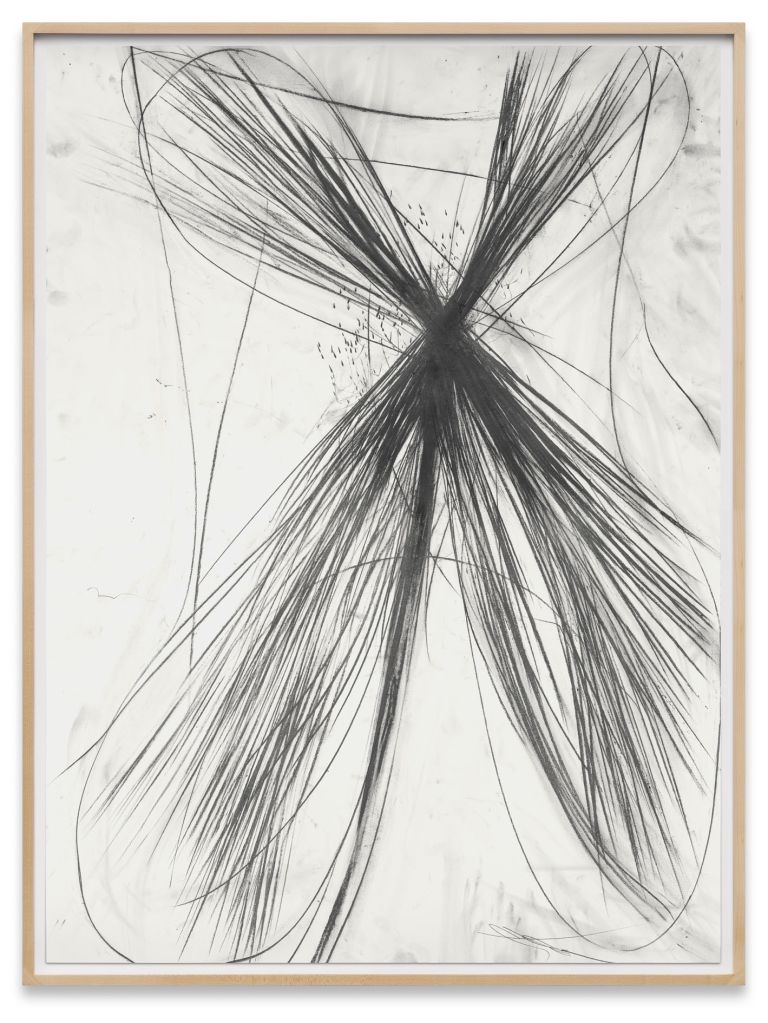 Framed abstract drawing showing X-shaped black graphite burst with radiating lines on white background