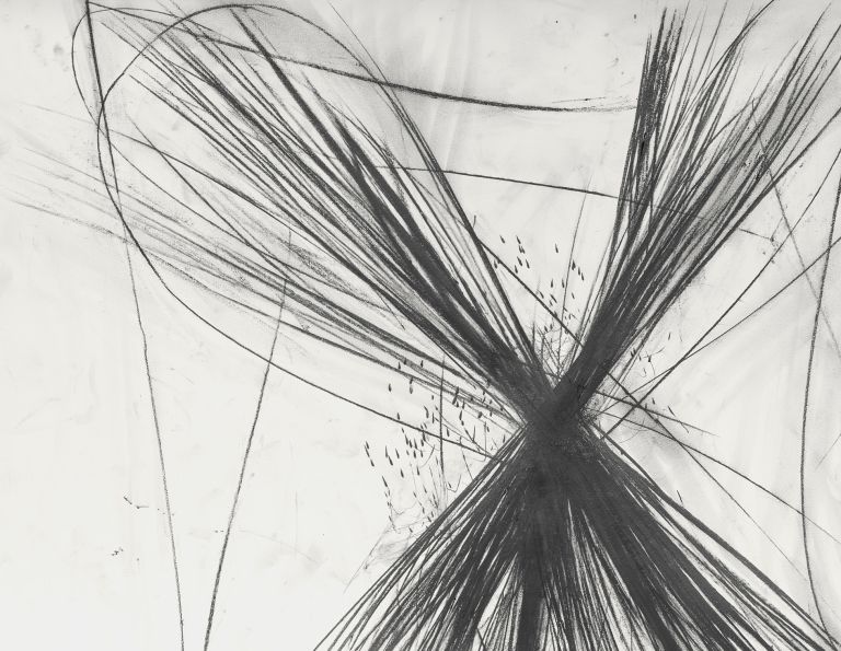 Framed abstract drawing showing X-shaped black graphite burst with radiating lines on white background