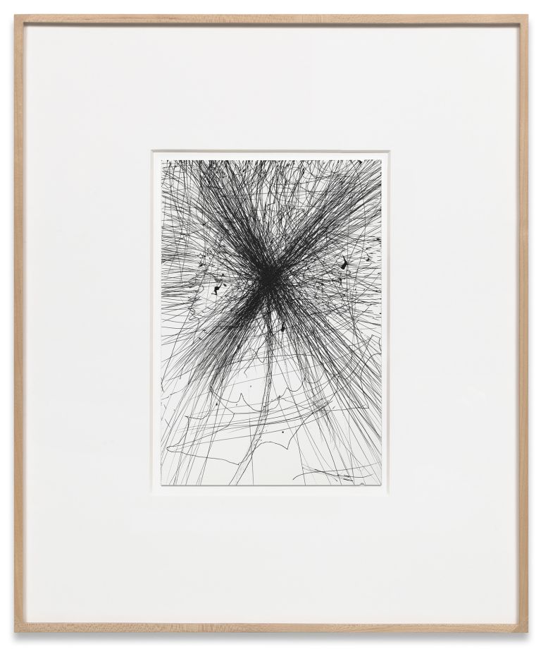 Framed drawing of radiating black graphite lines bursting from central point, matted in white