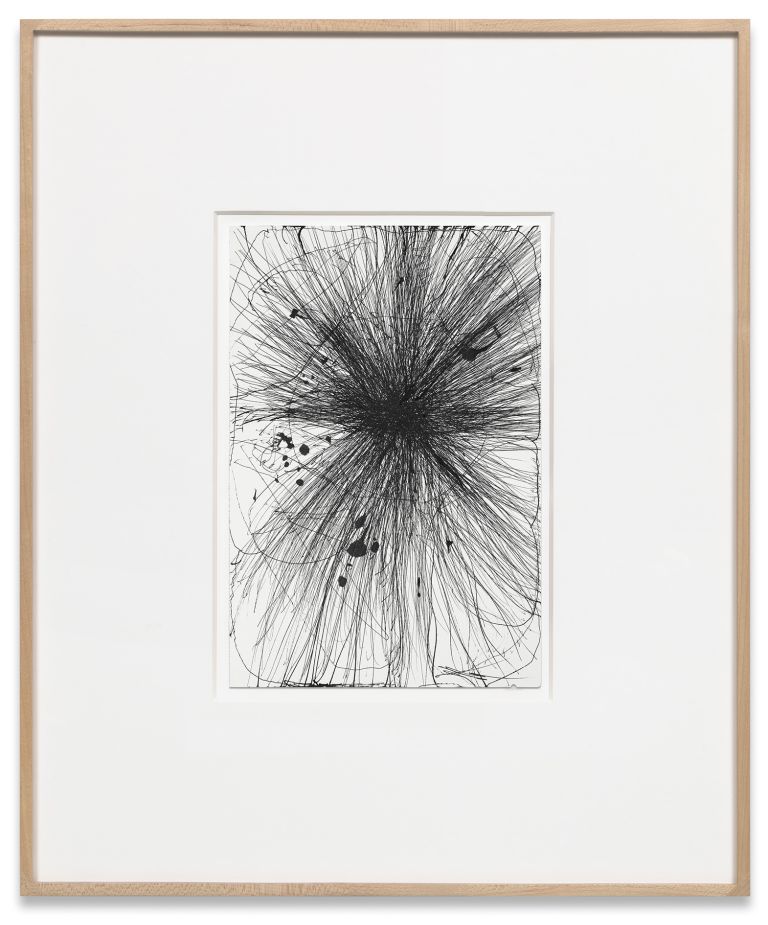 Framed drawing with explosive black graphite marks radiating outward, matted in white frame