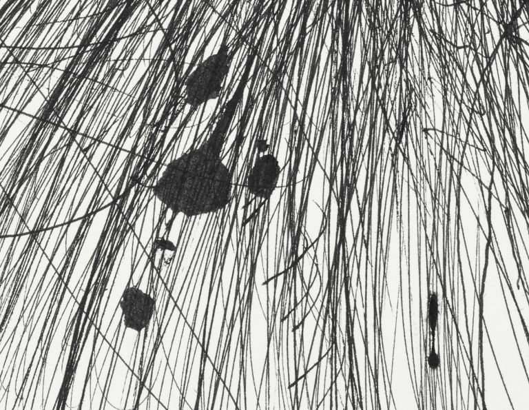 Framed drawing with explosive black graphite marks radiating outward, matted in white frame