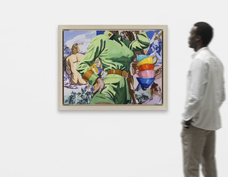 Headless figure in green jumpsuit with gold belt, stacked colorful cups at right, nude figures in background.